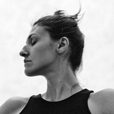 Poli Nemkova in profile, black-and-white portrait, eyes closed