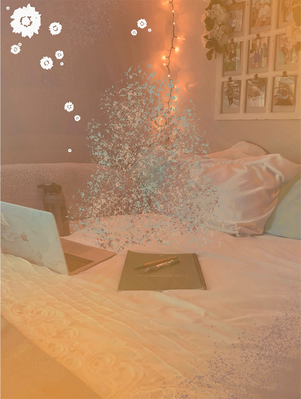 A bedroom work space; laptop computer on the bed